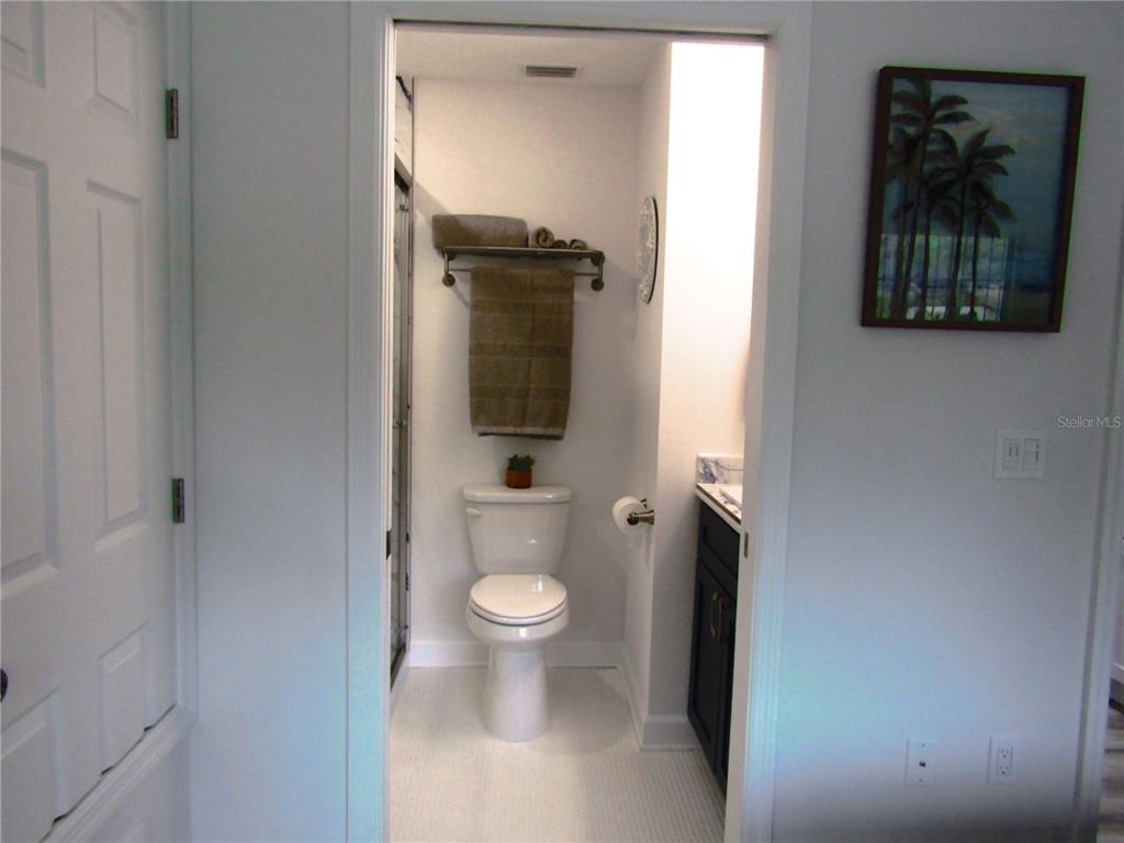 3531 Longmeadow, Unit 16 Sarasota, FL 34235 - Photo 22 of 29 a bathroom with a toilet and a sink