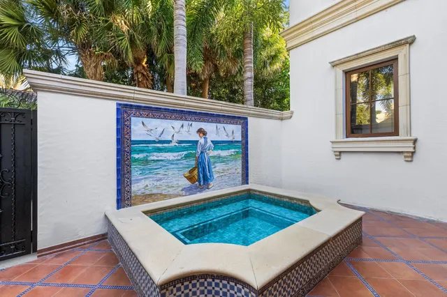 a view of a patio with table and chairs and potted plants