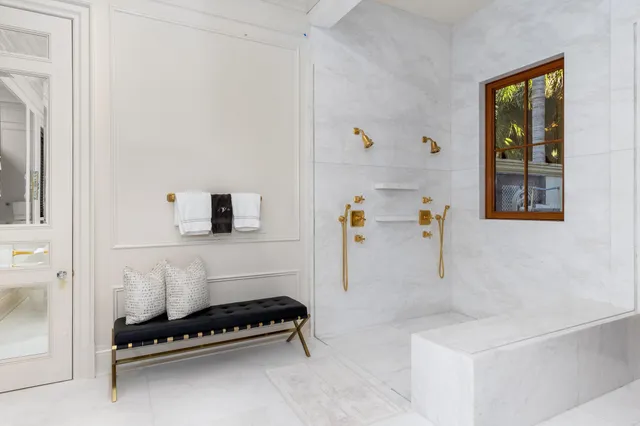 a backyard of a house with a garden and outdoor seating