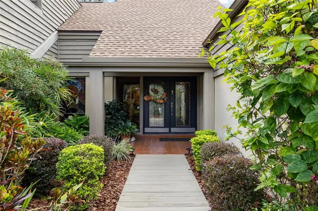 a view of swimming pool with chairs and tables