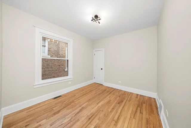 a kitchen with a refrigerator sink and cabinets