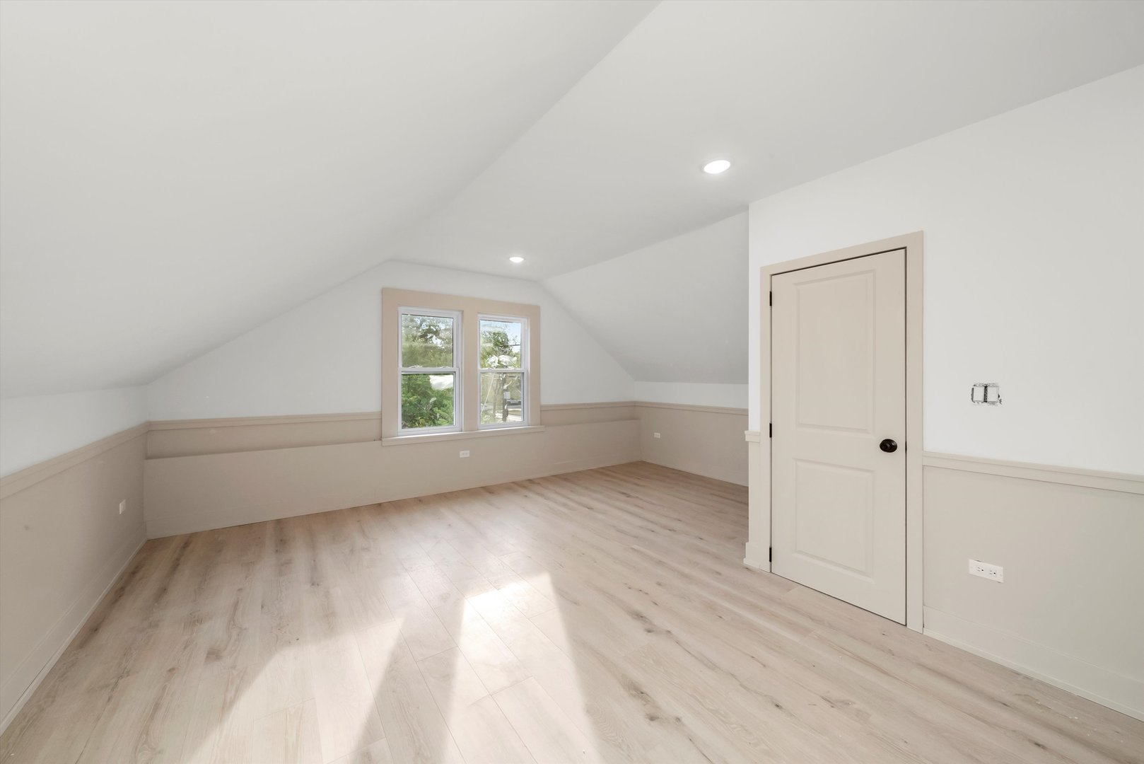 7955 South Colfax Avenue Chicago, IL 60617 - Photo 16 of 43 wooden floor in an empty room with a window