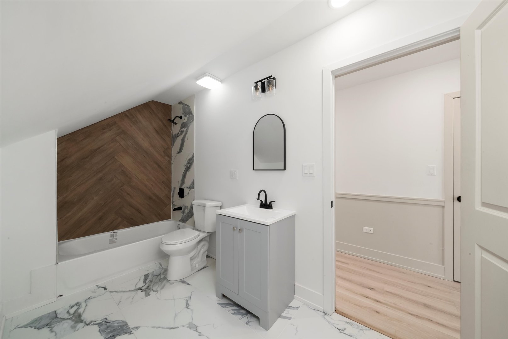 7955 South Colfax Avenue Chicago, IL 60617 - Photo 18 of 43 a bathroom with a sink toilet and shower