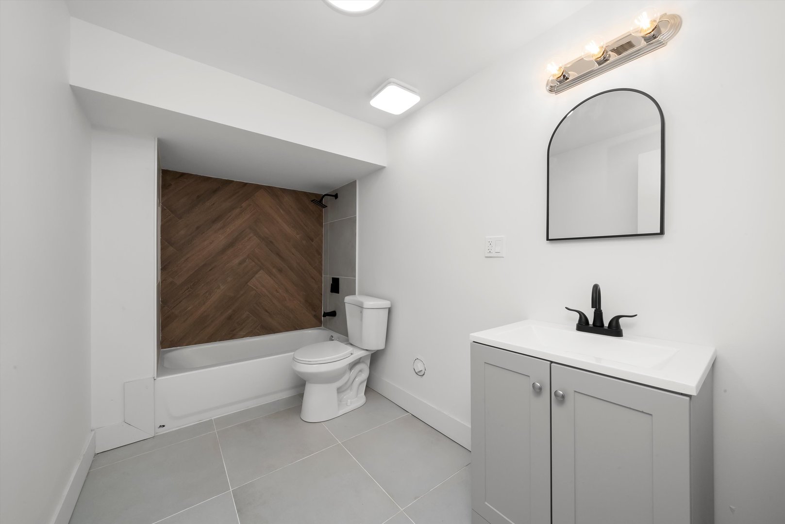 7955 South Colfax Avenue Chicago, IL 60617 - Photo 26 of 43 a bathroom with a toilet sink and mirror