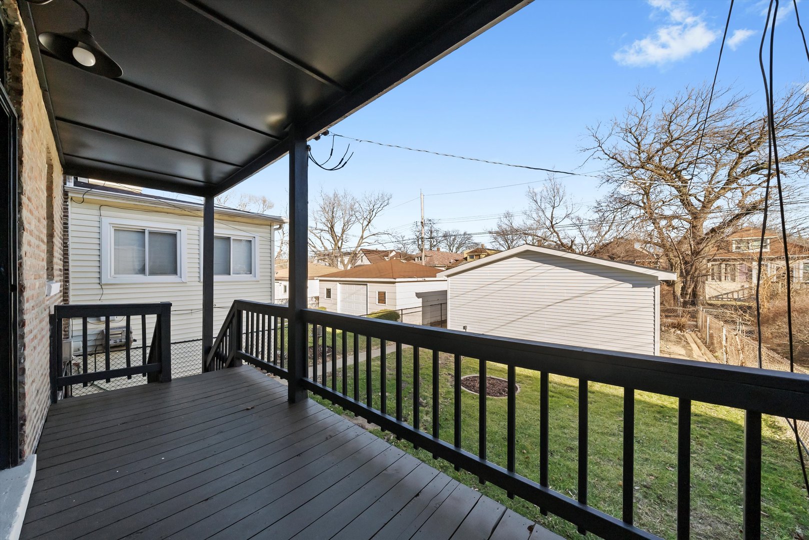 7955 South Colfax Avenue Chicago, IL 60617 - Photo 30 of 43 a view of a balcony with furniture