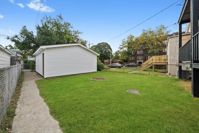 a front view of a house with a yard and porch