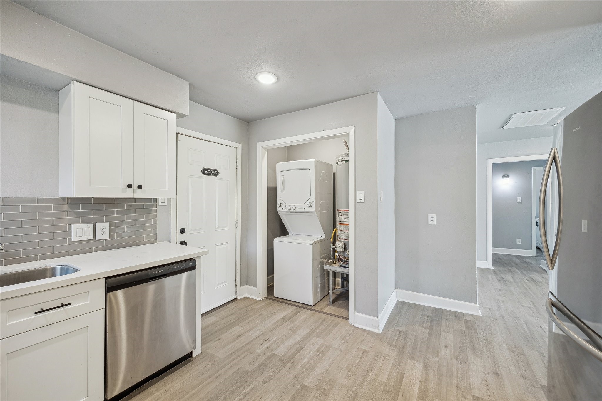4523 Keystone Street Houston, TX 77021 - Photo 12 of 23 a kitchen with a sink and refrigerator