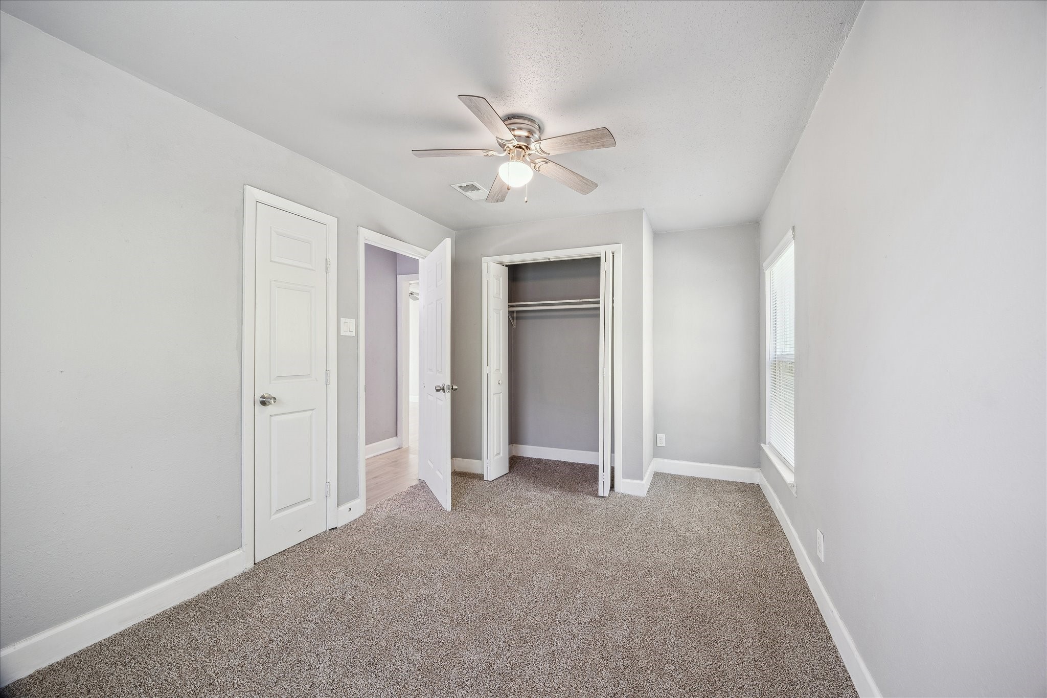 4523 Keystone Street Houston, TX 77021 - Photo 14 of 23 a view of a livingroom with a ceiling fan and window