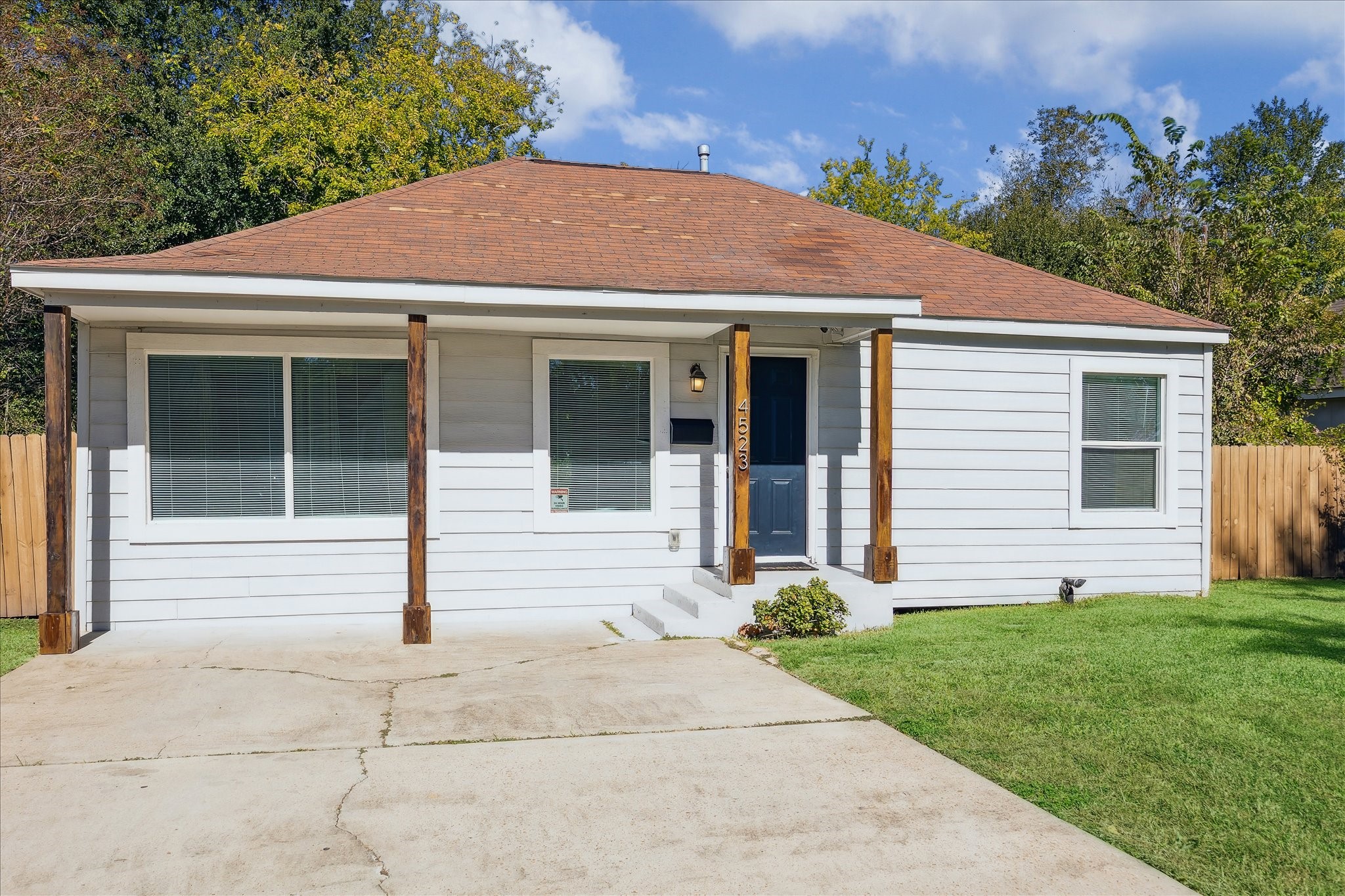 4523 Keystone Street Houston, TX 77021 - Photo 3 of 23 a front view of a house with a yard and garage