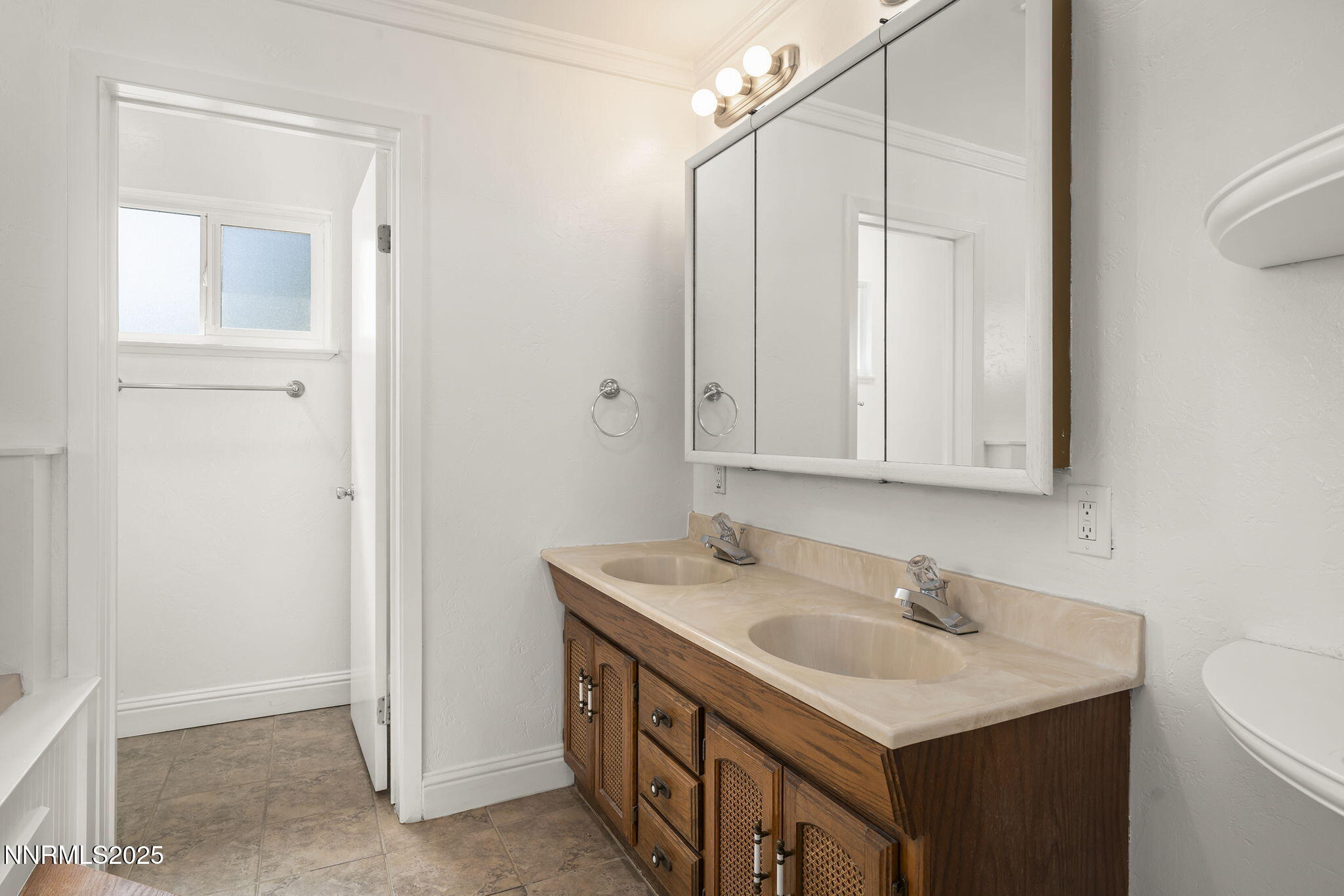 1420 Exeter Way Reno, NV 89503 - Photo 17 of 34 a bathroom with a sink a vanity and a mirror