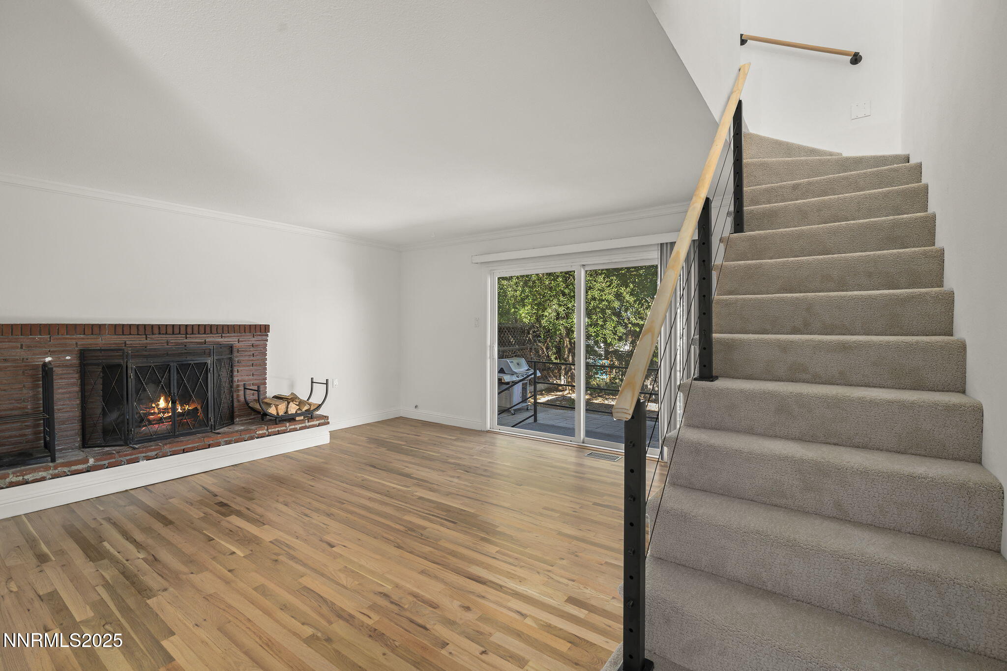 1420 Exeter Way Reno, NV 89503 - Photo 6 of 34 a view of an empty room with stairs and a fireplace