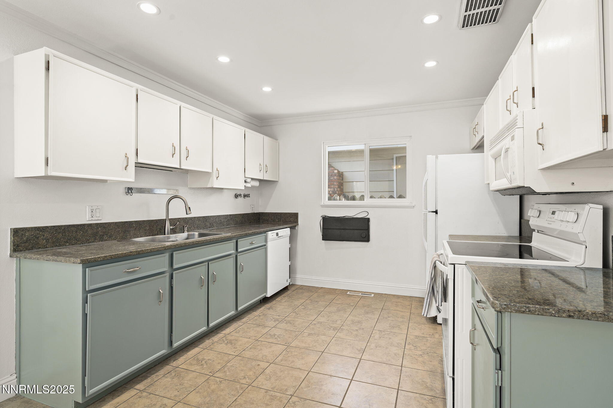 1420 Exeter Way Reno, NV 89503 - Photo 10 of 34 a kitchen with a sink window and cabinets
