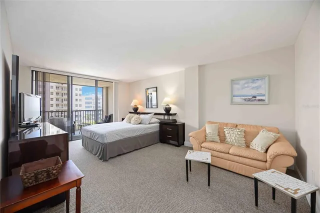 a bedroom with a bed and a couch