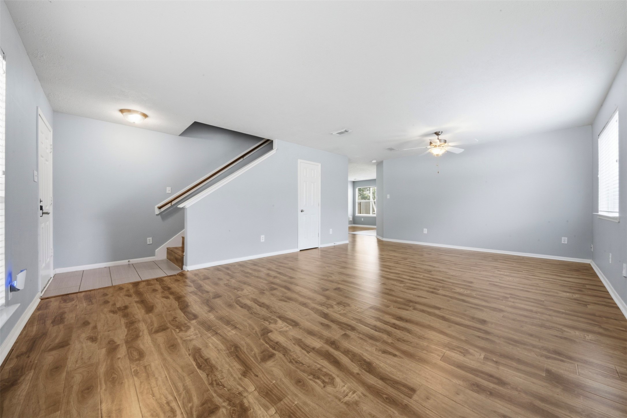 2446 Halstead Drive Spring, TX 77386 - Photo 7 of 45 Wood laminate flooring flows through the living areas for a seamless look.