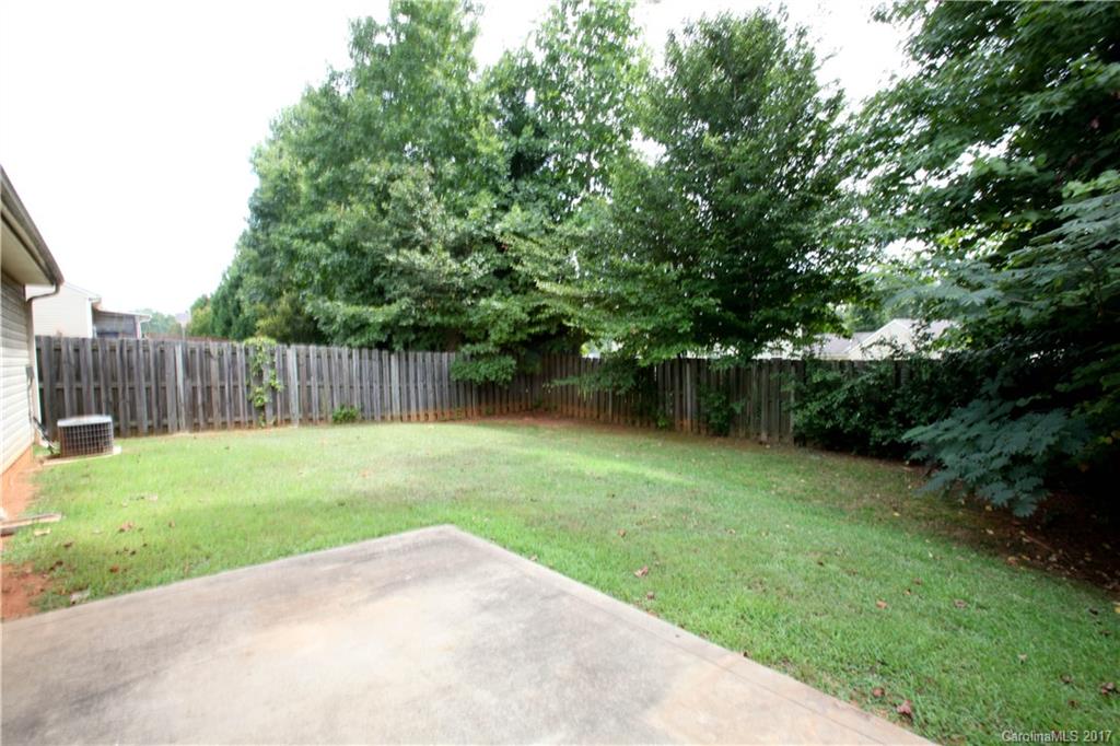 5004 Deerton Road Charlotte, NC 28269 - Photo 7 of 7 a view of a backyard with green space