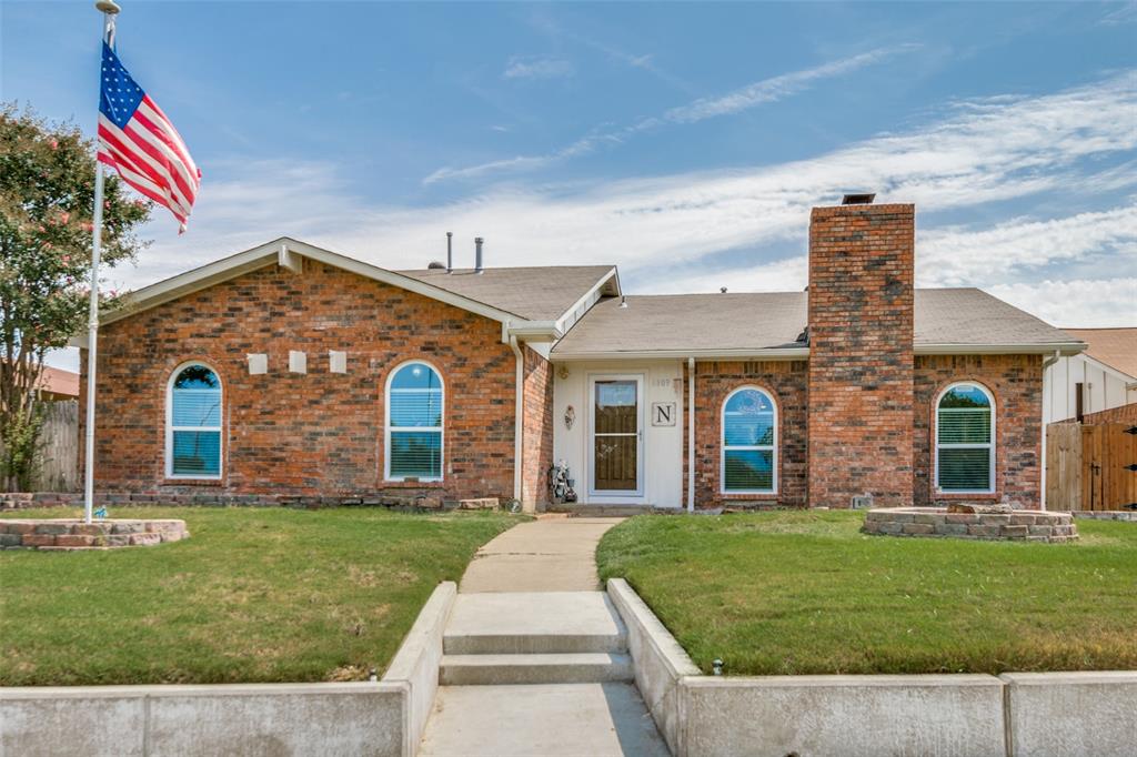 6809 Ragan Drive The Colony, TX 75056 - Photo 1 of 1 a front view of a house with garden