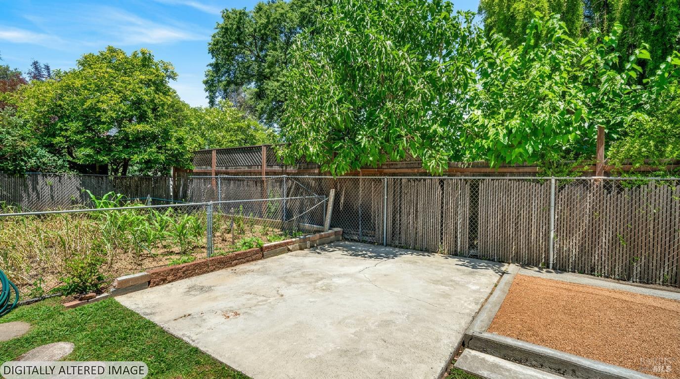 92 Oak Knoll Road Ukiah, CA 95482 - Photo 24 of 35 a view of a backyard with a small cabin and wooden fence