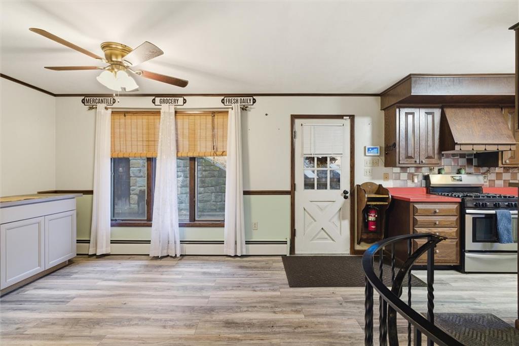 312 Flatwoods Road Vanderbilt, PA 15486 - Photo 17 of 50 a view of a livingroom with furniture hardwood floor ceiling fan and windows