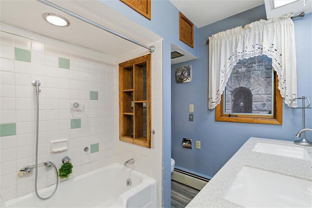 312 Flatwoods Road Vanderbilt, PA 15486 - Photo 20 of 50 a bathroom with a bathtub and a shower