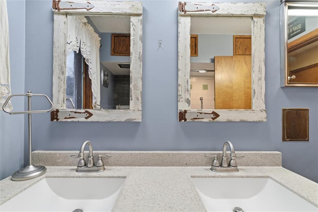 312 Flatwoods Road Vanderbilt, PA 15486 - Photo 21 of 50 a bathroom with a sink and a mirror