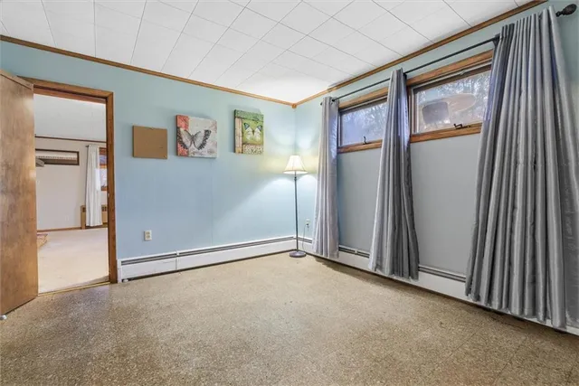 an empty room with closet and a window