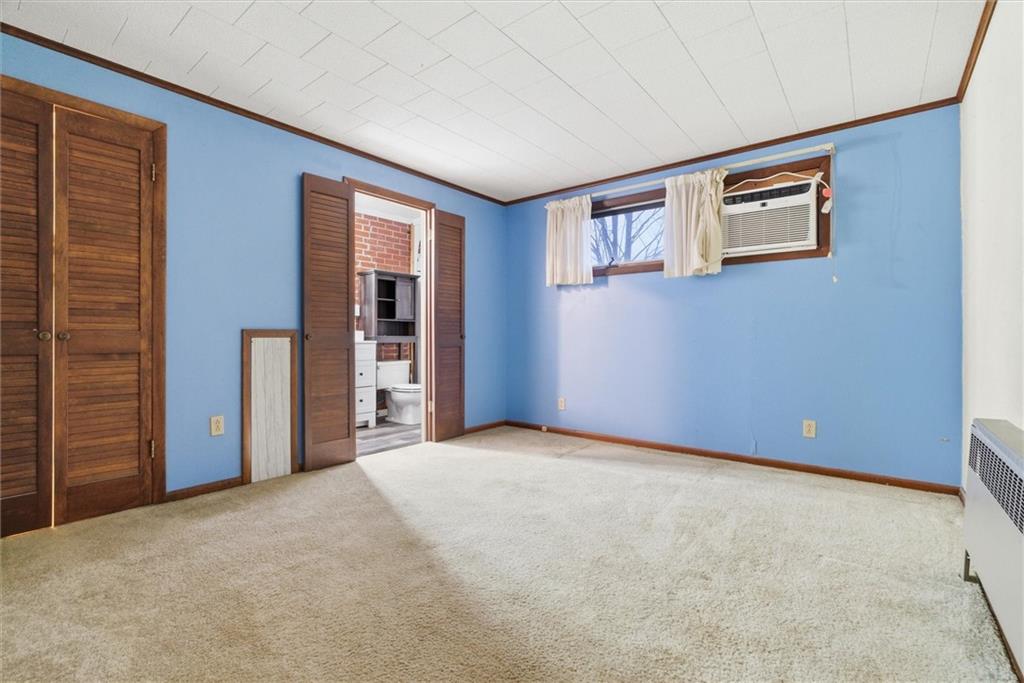 312 Flatwoods Road Vanderbilt, PA 15486 - Photo 27 of 50 a view of an empty room with closet and wooden door
