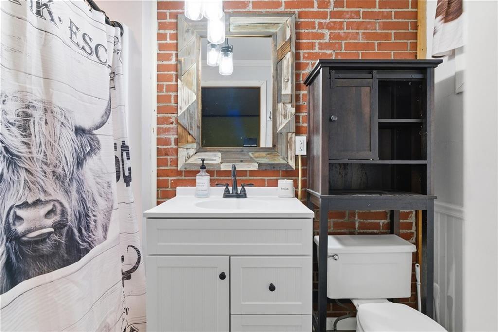312 Flatwoods Road Vanderbilt, PA 15486 - Photo 29 of 50 a bathroom with a sink toilet and mirror