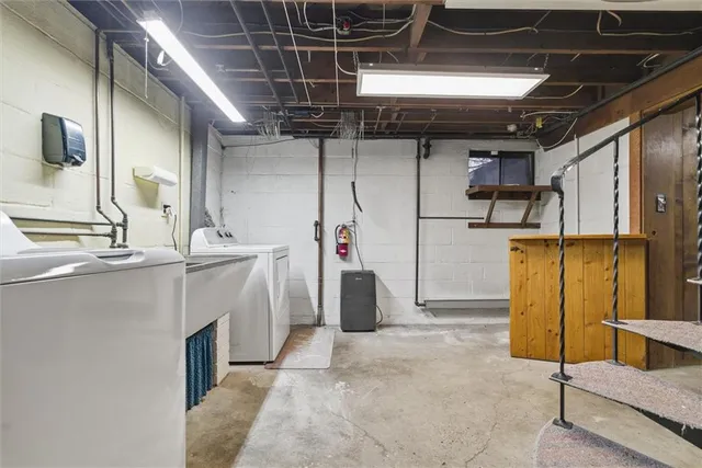 a utility room with washer and dryer