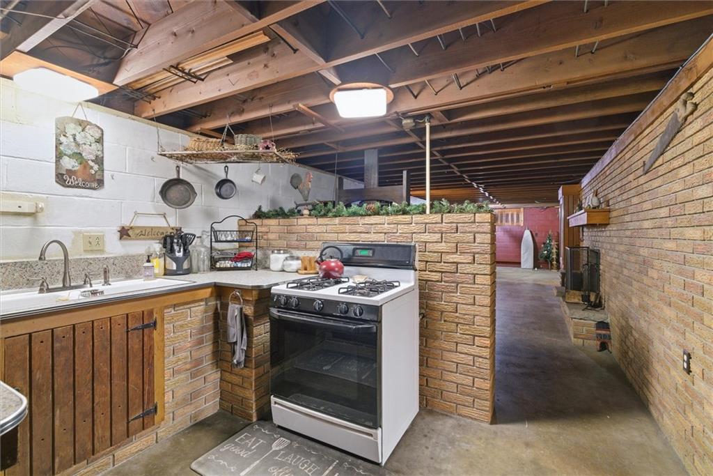 312 Flatwoods Road Vanderbilt, PA 15486 - Photo 34 of 49 a open kitchen with a stove and a sink