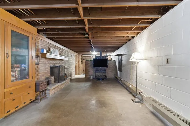 a view of an empty room with wooden shelves