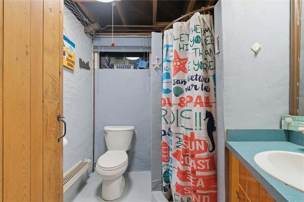 312 Flatwoods Road Vanderbilt, PA 15486 - Photo 44 of 50 a bathroom with a toilet and shower curtain