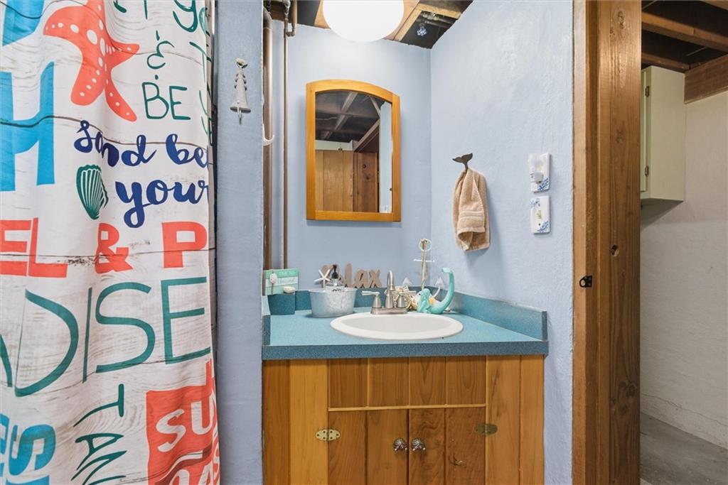 312 Flatwoods Road Vanderbilt, PA 15486 - Photo 45 of 50 a bathroom with a sink and a mirror