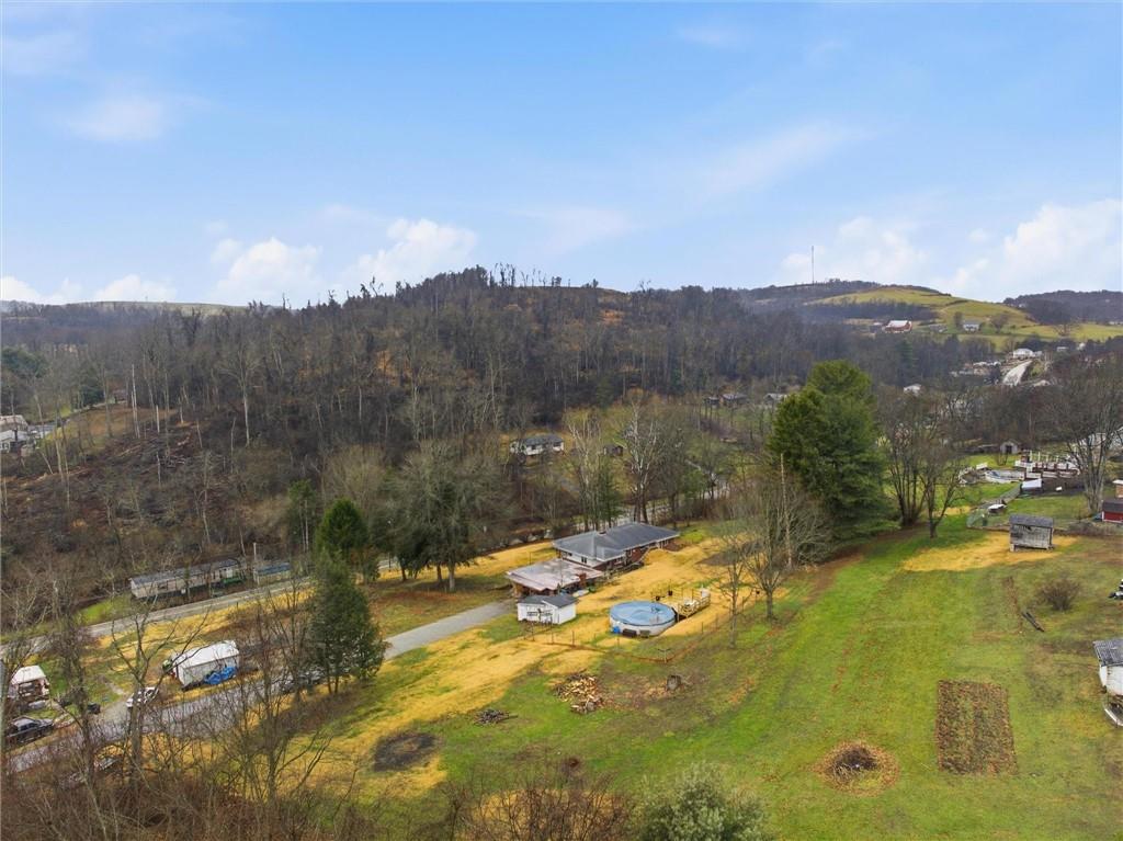 312 Flatwoods Road Vanderbilt, PA 15486 - Photo 5 of 50 a view of a lake with a mountain