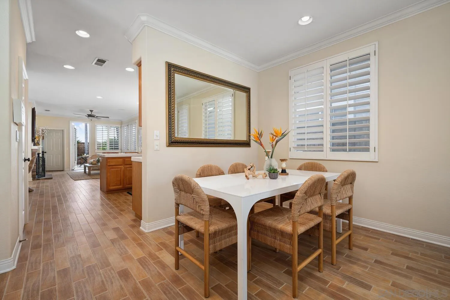 6891 Tradewinds Drive Carlsbad, CA 92011 - Photo 20 of 55 a view of a dining room with furniture and wooden floor