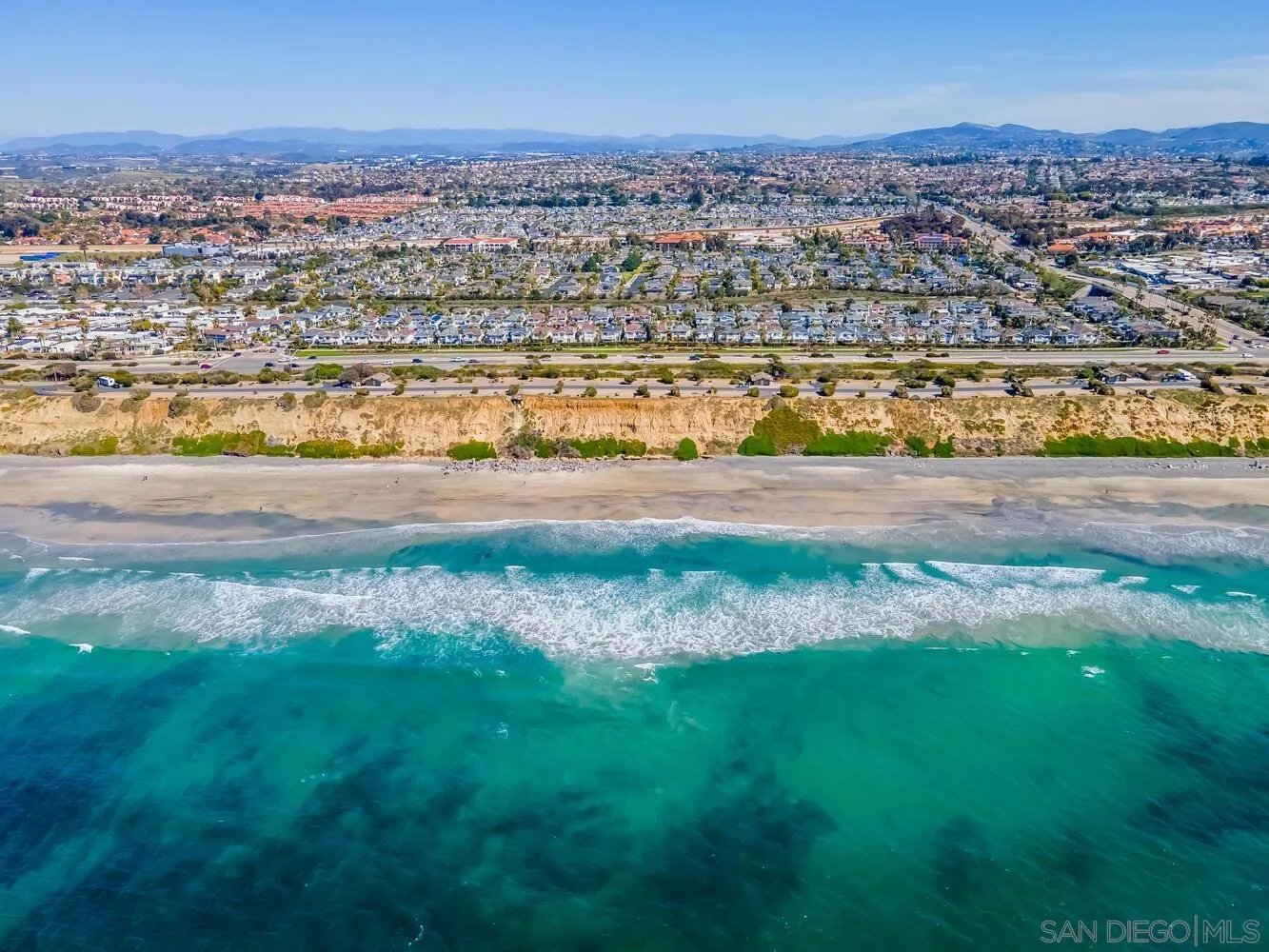 6891 Tradewinds Drive Carlsbad, CA 92011 - Photo 2 of 55 an aerial view of a houses with beach