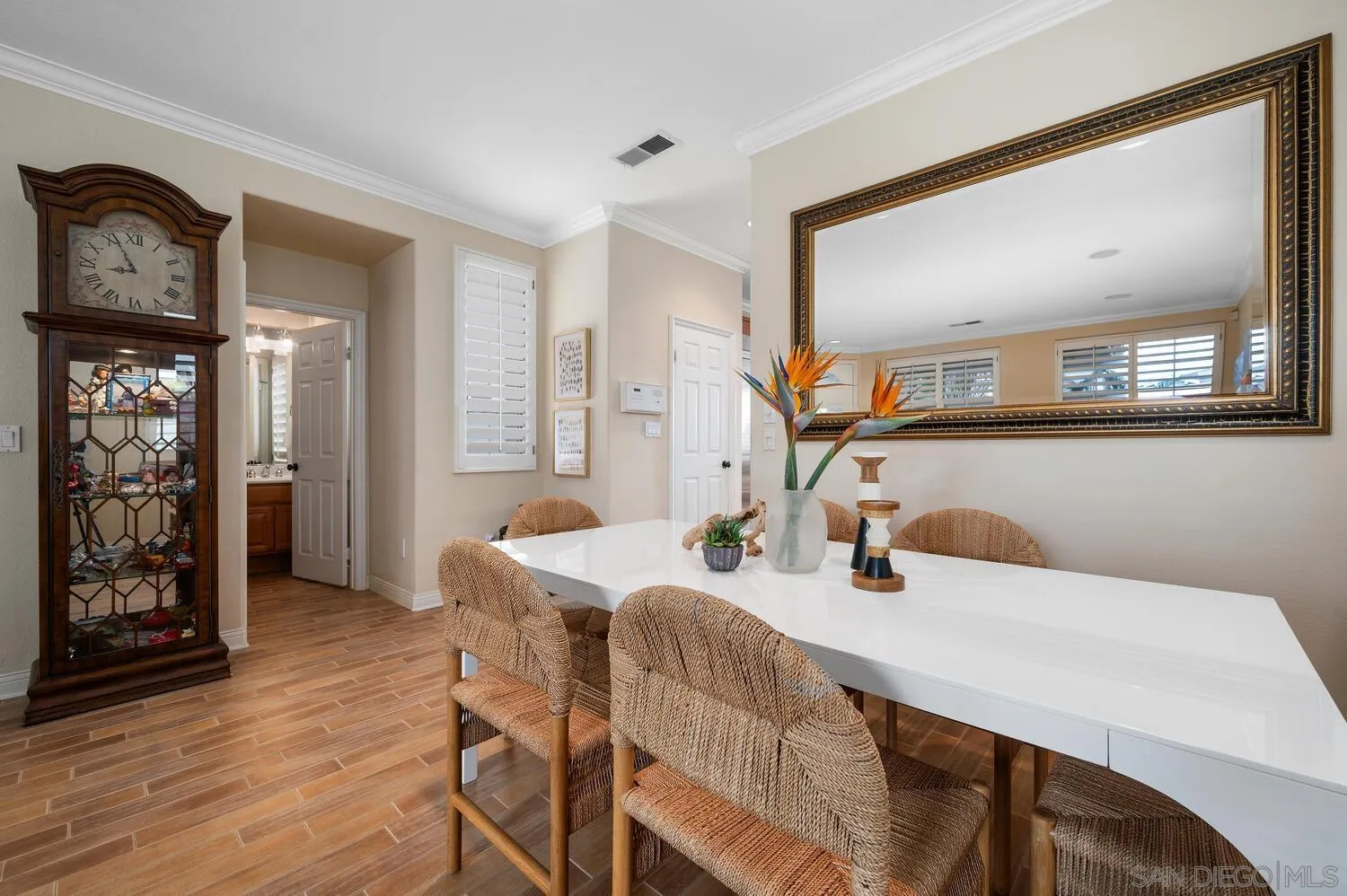 6891 Tradewinds Drive Carlsbad, CA 92011 - Photo 21 of 55 a view of a dining room with furniture and wooden floor