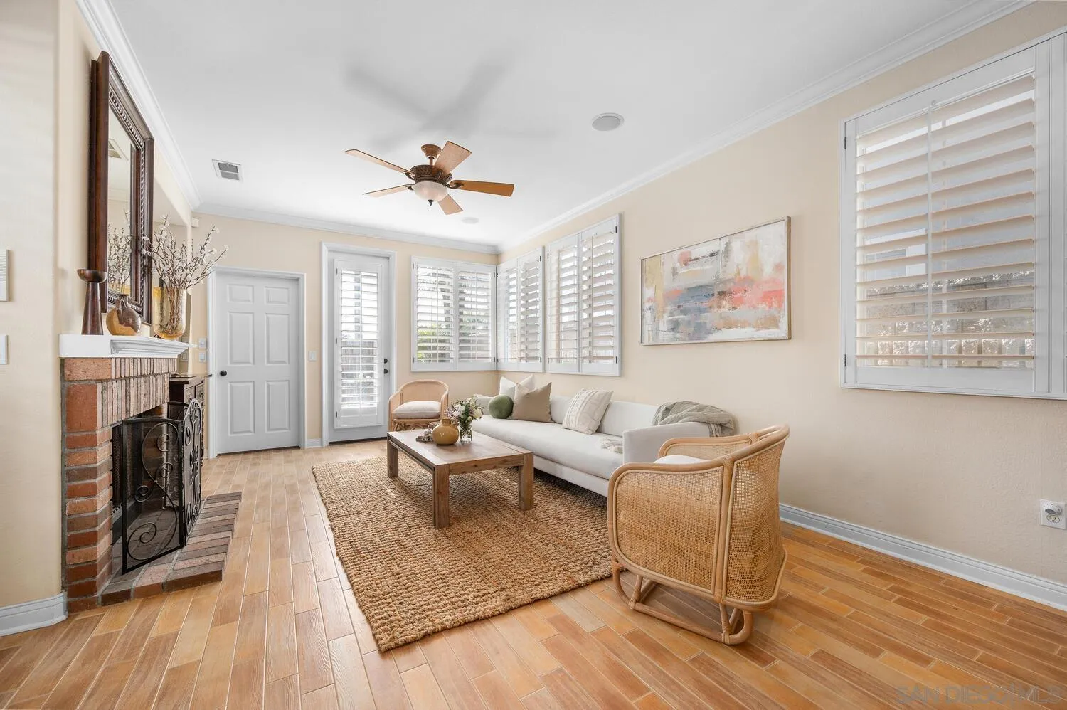 6891 Tradewinds Drive Carlsbad, CA 92011 - Photo 27 of 55 a living room with furniture and a fireplace