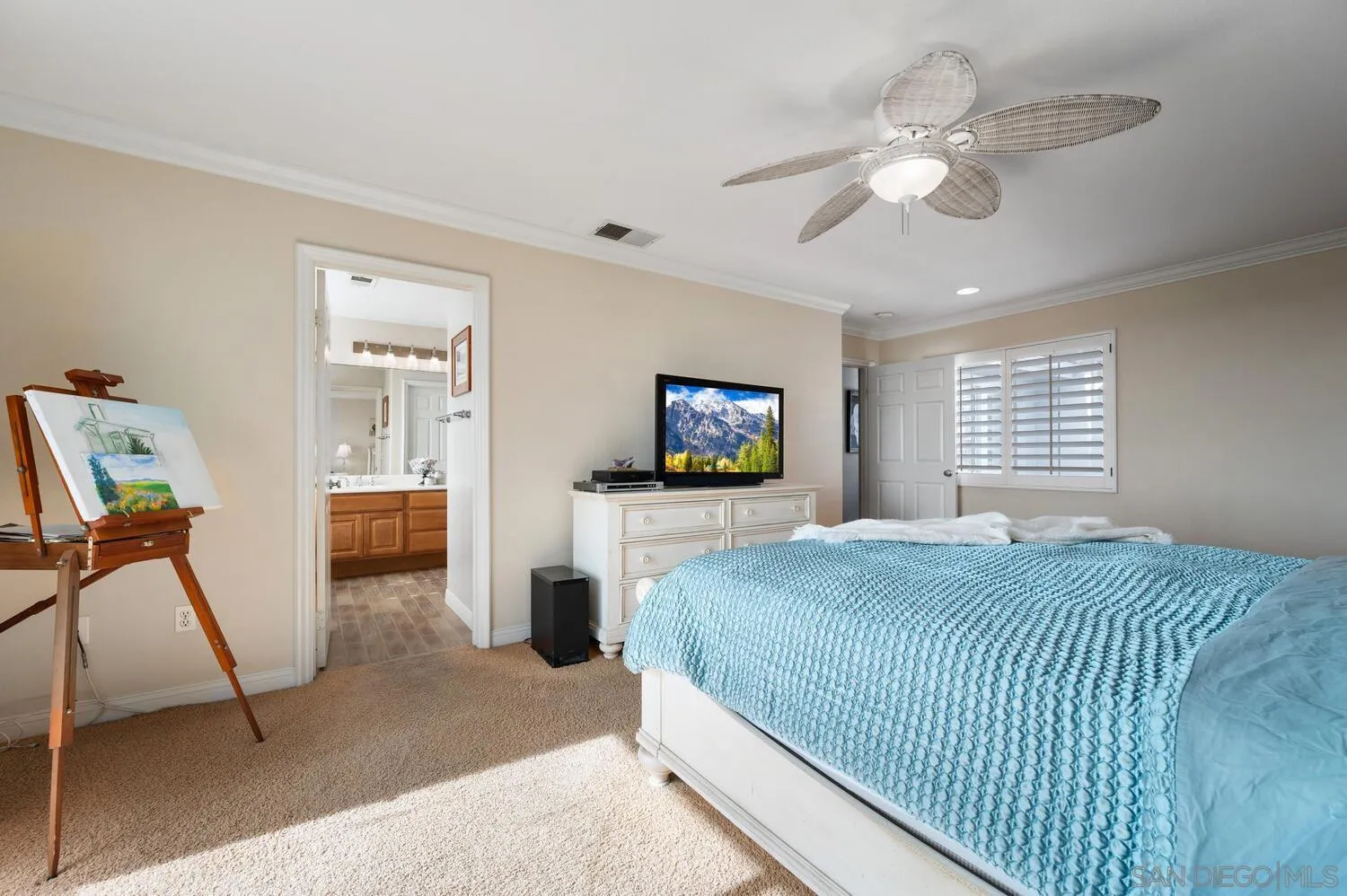 6891 Tradewinds Drive Carlsbad, CA 92011 - Photo 33 of 55 a bedroom with a bed and a flat screen tv