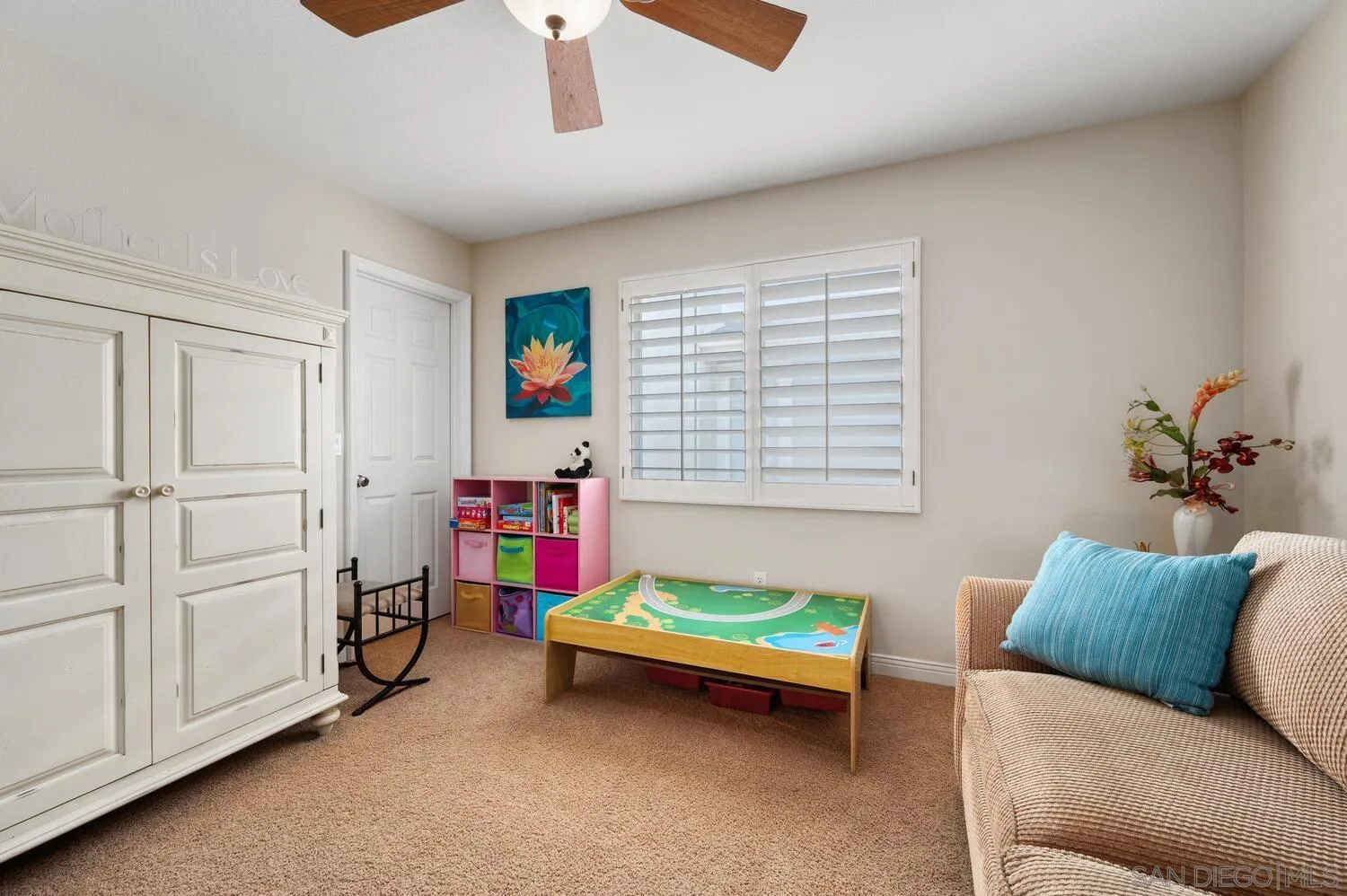 6891 Tradewinds Drive Carlsbad, CA 92011 - Photo 36 of 55 a bedroom with a bed and a couch