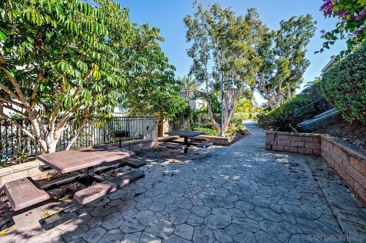 6891 Tradewinds Drive Carlsbad, CA 92011 - Photo 42 of 55 a view of a backyard with chairs and a small yard