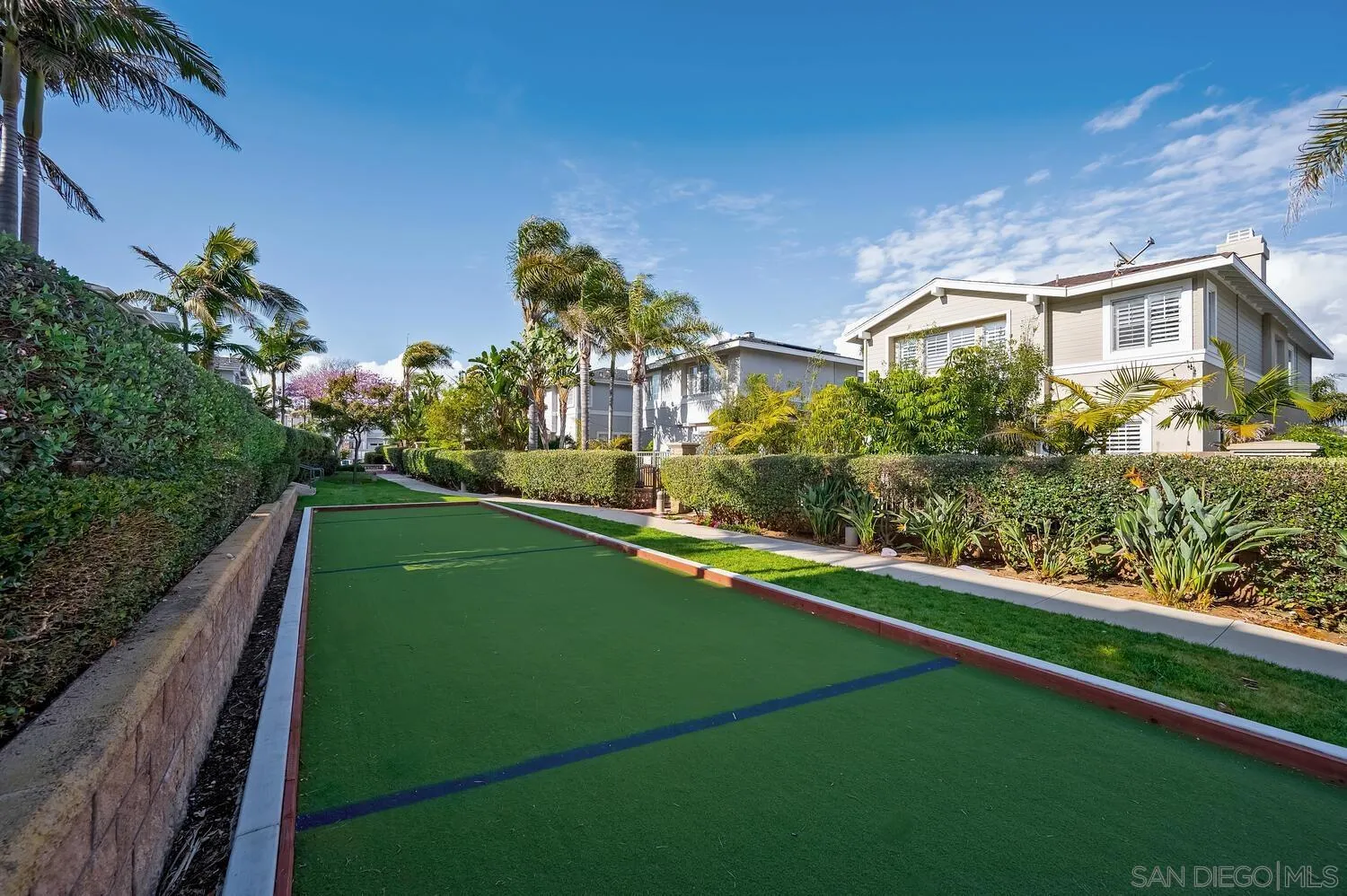 6891 Tradewinds Drive Carlsbad, CA 92011 - Photo 46 of 55 a view of a house with pool and a garden