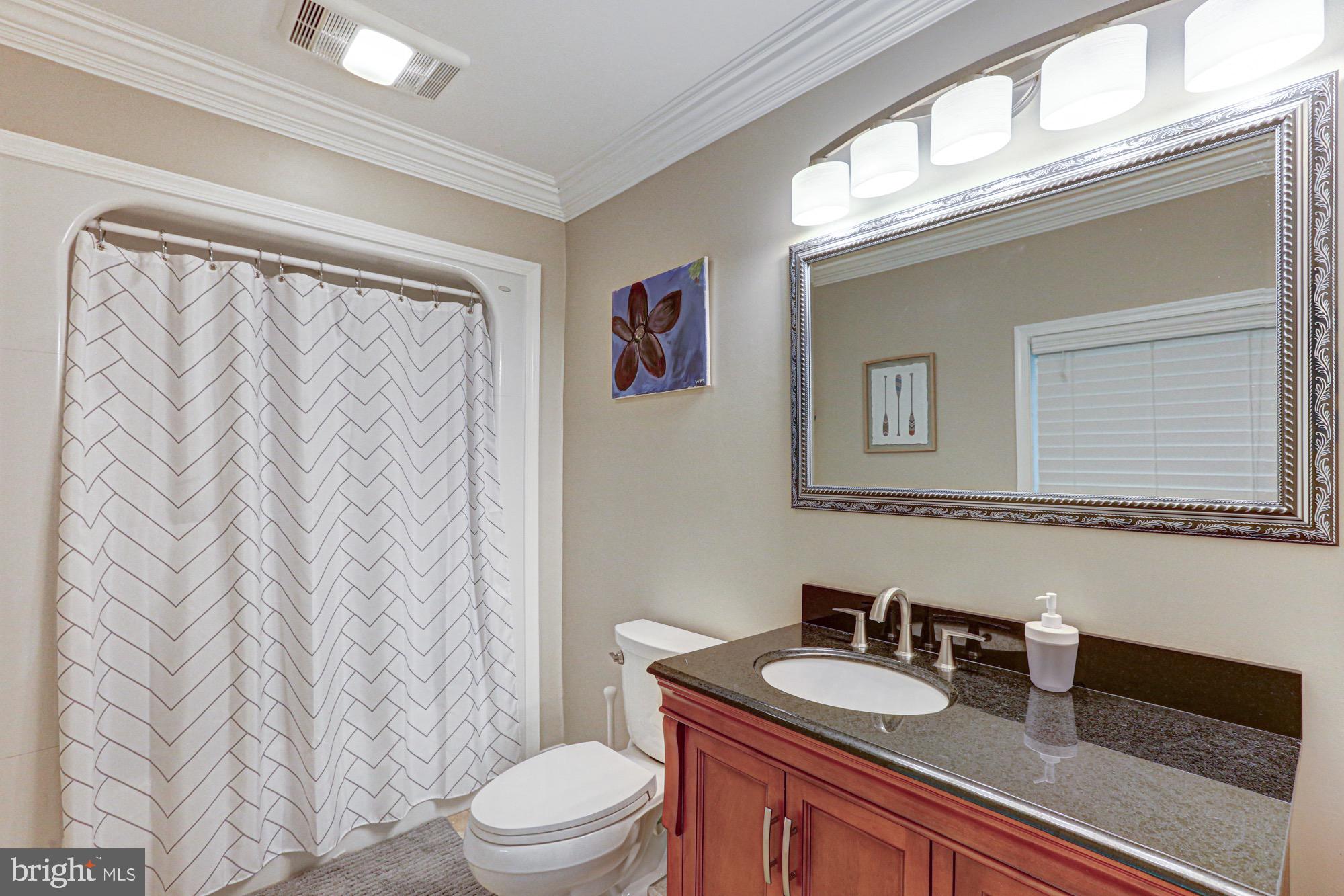 104 Dungarvan Drive Middletown, DE 19709 - Photo 31 of 45 a bathroom with a granite countertop sink mirror vanity and toilet