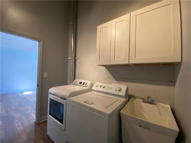a utility room with dryer and washer