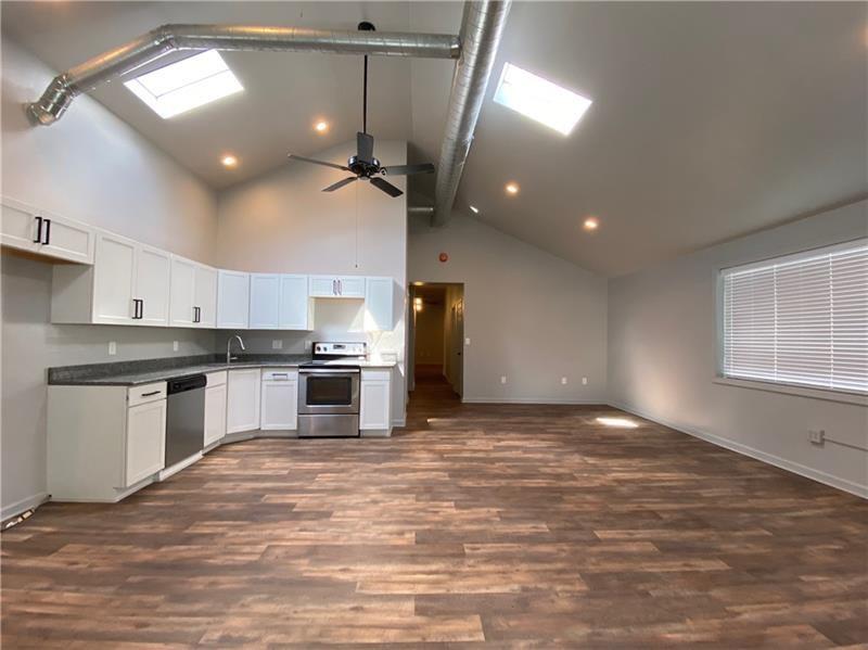 1108 4th Avenue Coraopolis, PA 15108 - Photo 3 of 15 a kitchen with stainless steel appliances granite countertop a stove a sink and a refrigerator