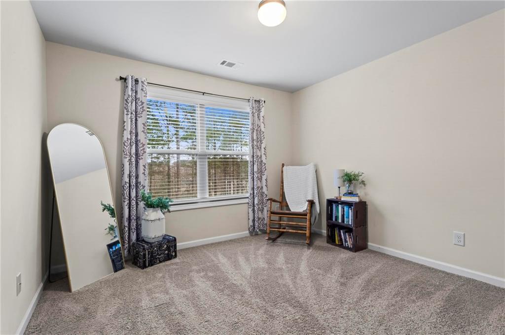 156 Starry Night Way Dallas, GA 30132 - Photo 17 of 28 a view of a livingroom with furniture and a large window