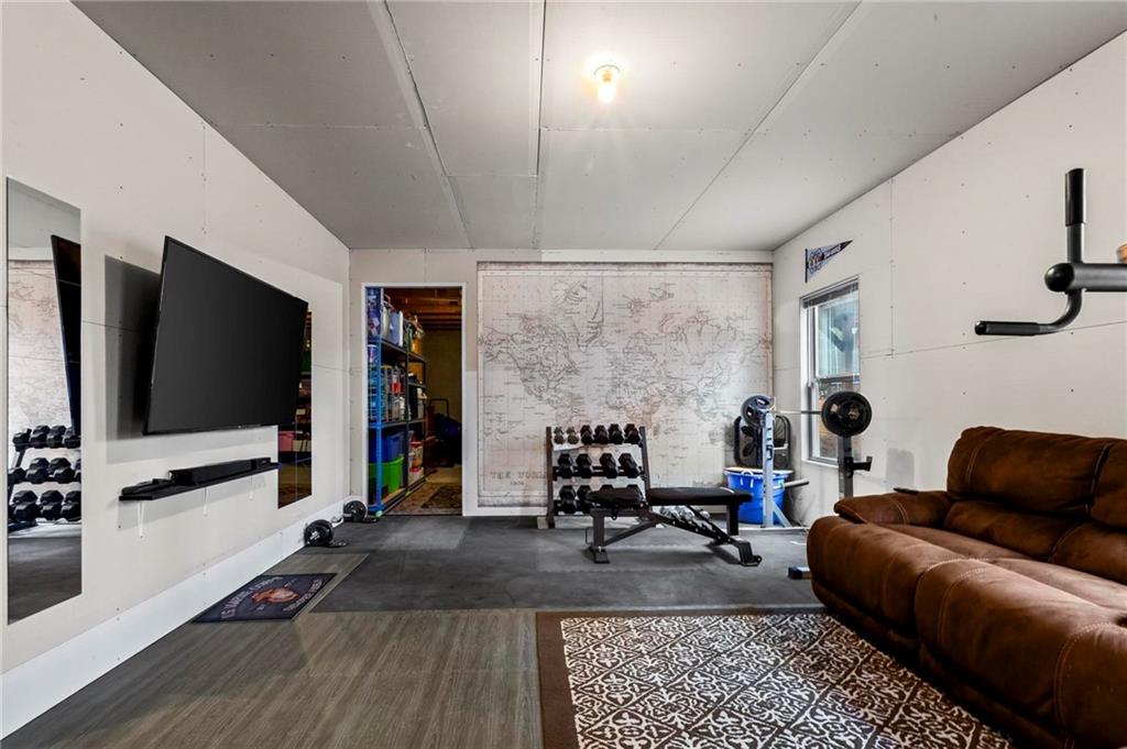 156 Starry Night Way Dallas, GA 30132 - Photo 19 of 28 a living room with furniture and a flat screen tv
