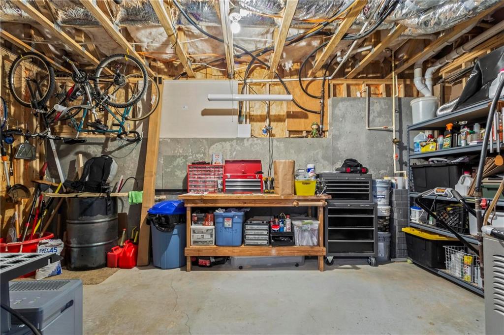 156 Starry Night Way Dallas, GA 30132 - Photo 20 of 28 a store with buildings and cars park