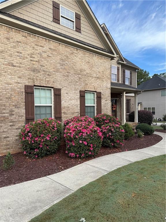 156 Starry Night Way Dallas, GA 30132 - Photo 22 of 28 a view of a house with a yard