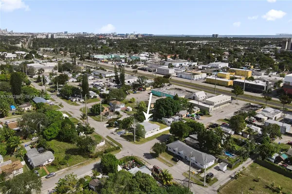 an aerial view of residential houses with city view