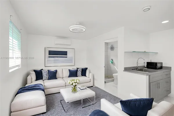 a living room with furniture and a table